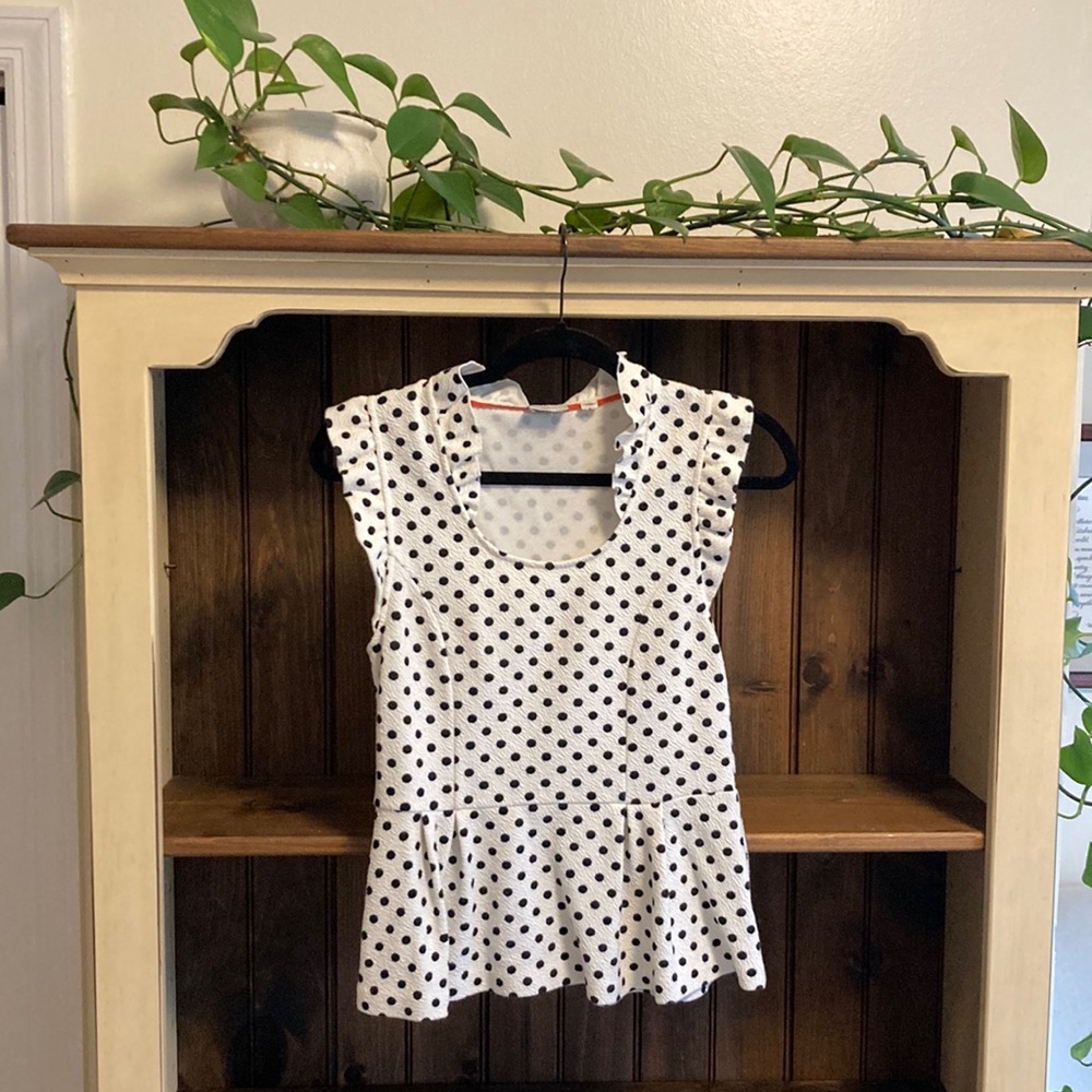 Anthropologie Peplum top in black and white polka dots, size small